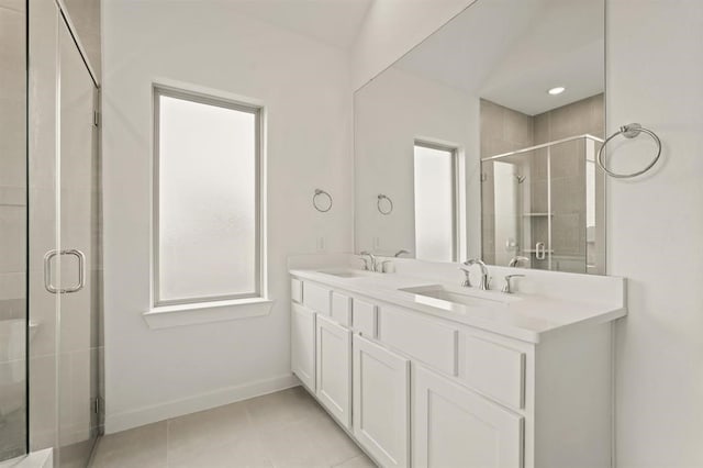 4918 Shore Arbor Ln, Katy, TX 77493 - full bath featuring a stall shower, double vanity, tile patterned flooring, and baseboards