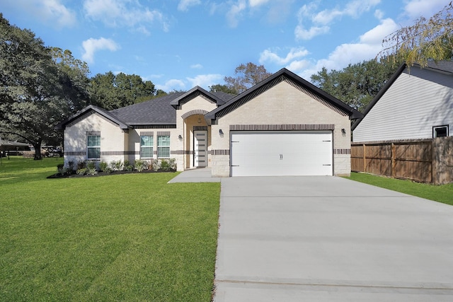 ranch-style house featuring a garage, concrete driveway, fence, a front yard, and brick siding