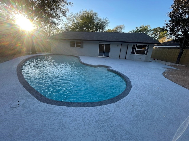 view of swimming pool with a fenced in pool, a patio area, and fence