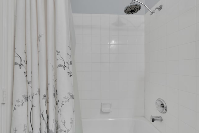 bathroom with shower / bath combination with curtain