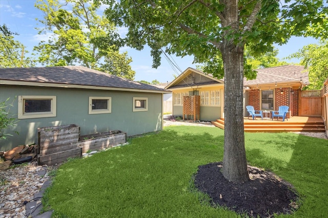 view of yard with a wooden deck