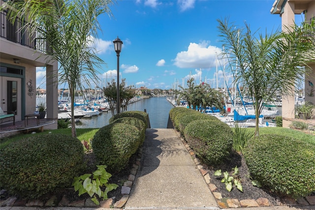 surrounding community featuring a water view