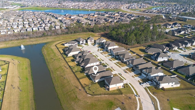 bird's eye view with a water view and a residential view