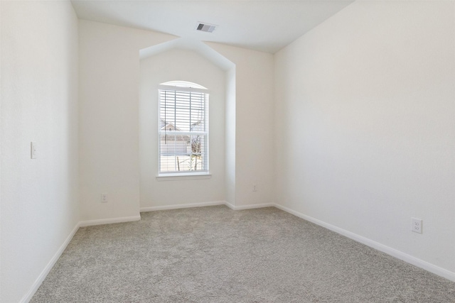 empty room featuring light carpet, baseboards, and visible vents