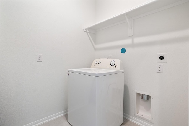 washroom featuring washer / dryer, laundry area, and baseboards