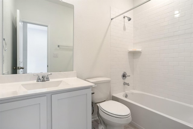 bathroom featuring bathtub / shower combination, vanity, and toilet