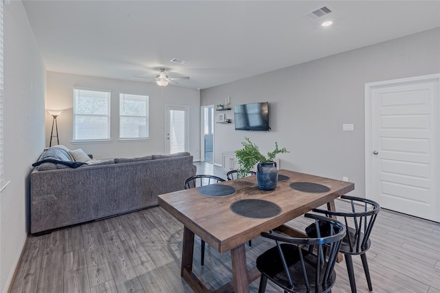 dining space with light wood-style flooring, recessed lighting, visible vents, and a ceiling fan