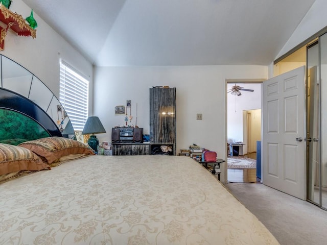 bedroom with light carpet and vaulted ceiling