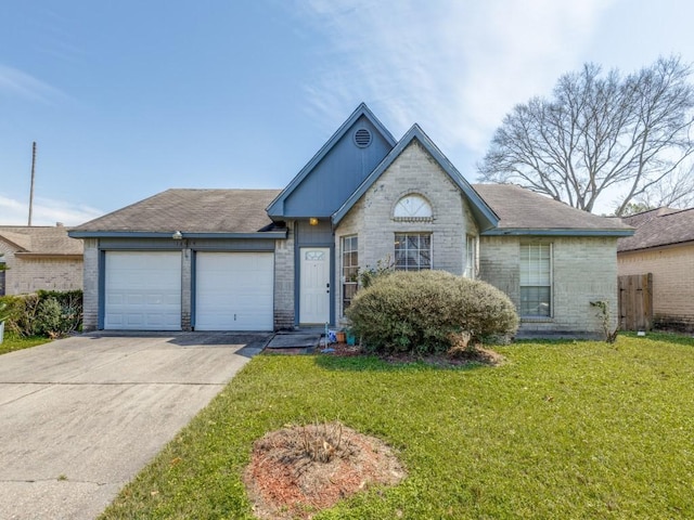 view of front of property with a front lawn, concrete driveway, brick siding, and an attached garage