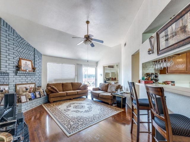 living area featuring a dry bar, high vaulted ceiling, a ceiling fan, and wood finished floors