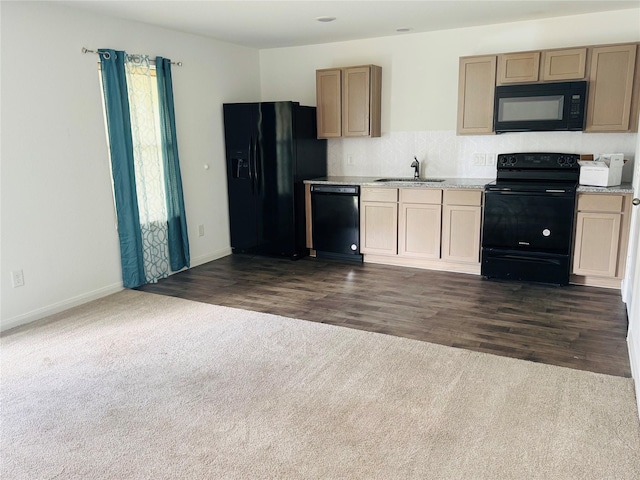 16955 Marie Village Dr, Conroe, TX 77306 - kitchen featuring black appliances, a sink, dark carpet, and light countertops