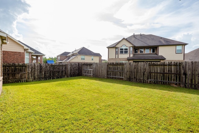 view of yard featuring a fenced backyard