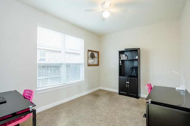 office with carpet floors, a ceiling fan, and baseboards