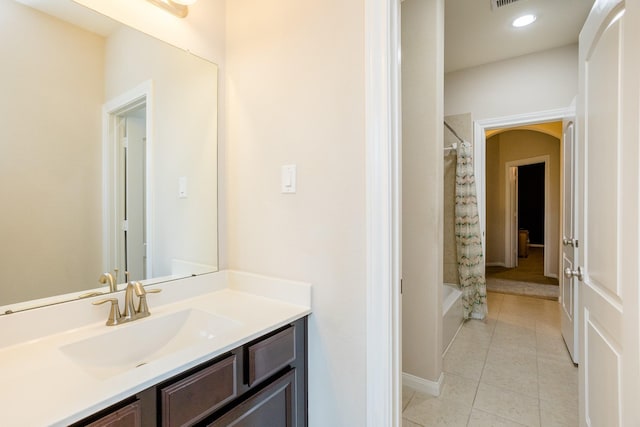 full bath featuring tile patterned flooring, vanity, shower / tub combo, and recessed lighting