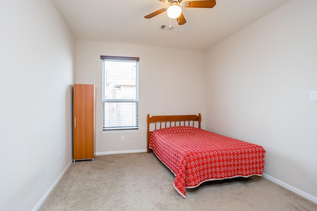 bedroom with carpet floors, ceiling fan, visible vents, and baseboards