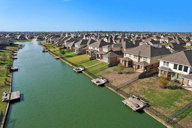 bird's eye view featuring a residential view and a water view