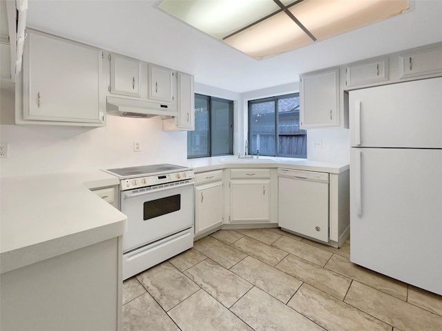 kitchen featuring light countertops, white cabinetry, a sink, white appliances, and under cabinet range hood