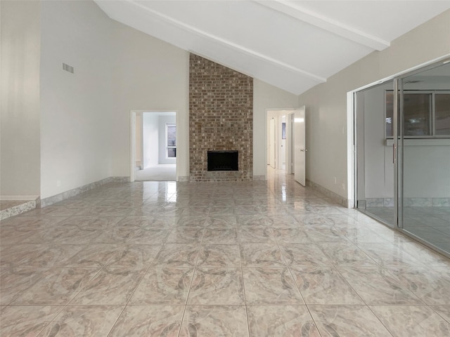 unfurnished living room with beam ceiling, a fireplace, visible vents, high vaulted ceiling, and baseboards