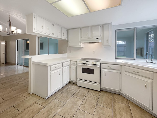 kitchen with white electric stove, an inviting chandelier, white cabinetry, a peninsula, and under cabinet range hood