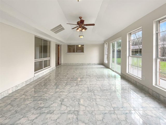 spare room featuring marble finish floor, visible vents, ceiling fan, and baseboards