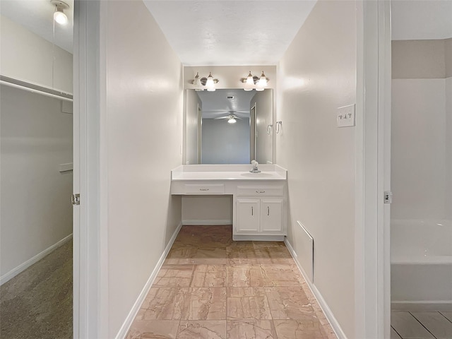 bathroom featuring vanity and baseboards