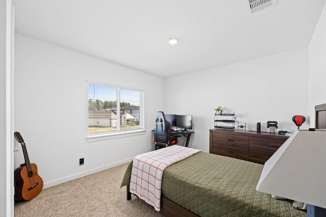 bedroom with visible vents, baseboards, and carpet