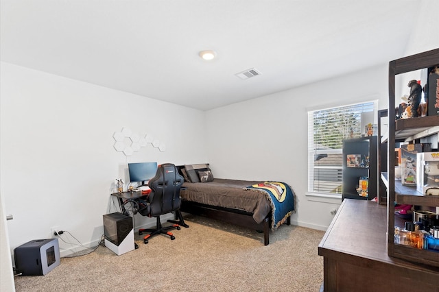 bedroom with visible vents, baseboards, and carpet floors