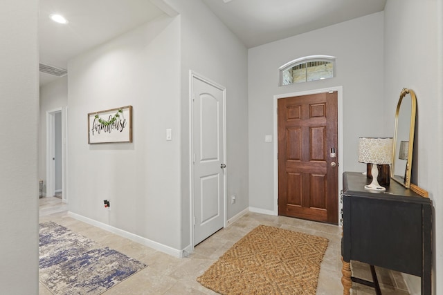 entryway with recessed lighting and baseboards