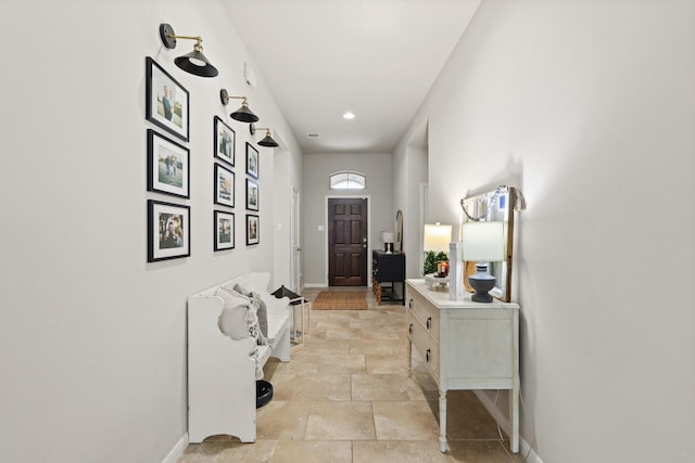 interior space with stone finish floor and baseboards