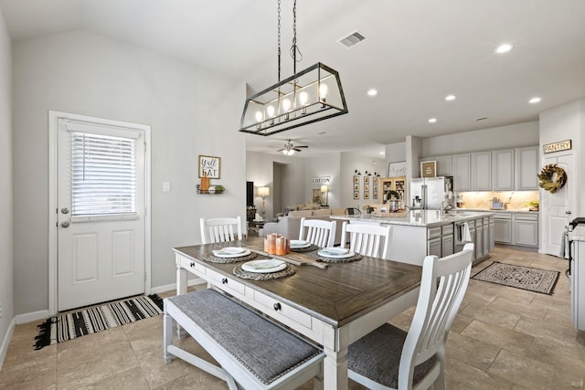 dining area featuring visible vents, ceiling fan with notable chandelier, recessed lighting, baseboards, and lofted ceiling