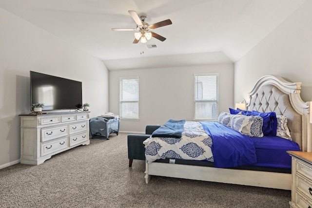 carpeted bedroom featuring visible vents, multiple windows, baseboards, and vaulted ceiling