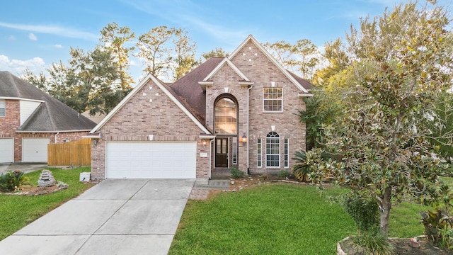 traditional home featuring a garage, driveway, brick siding, and a front lawn