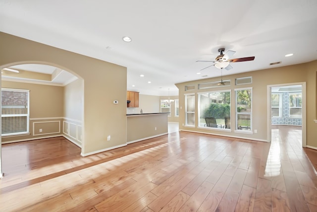 unfurnished room with arched walkways, recessed lighting, visible vents, a ceiling fan, and light wood finished floors