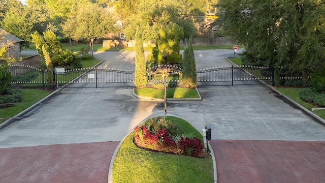 view of community with fence and a gate