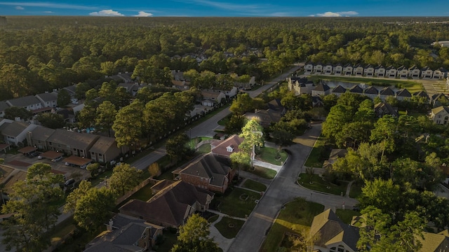 bird's eye view featuring a residential view and a view of trees