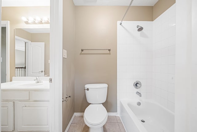 full bath with baseboards, toilet, tile patterned flooring, vanity, and shower / bathing tub combination