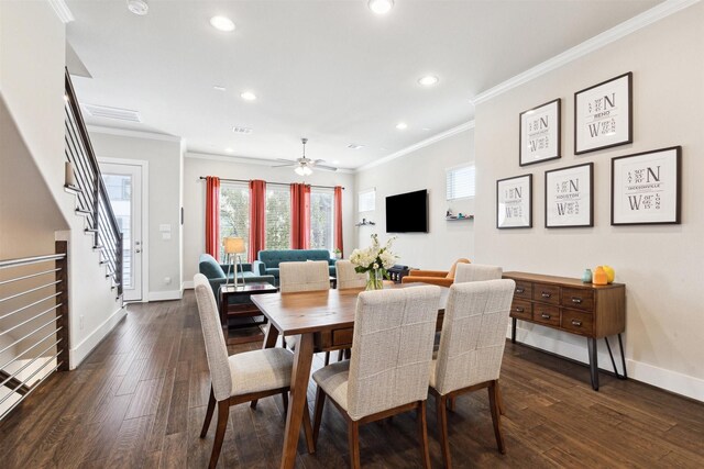 dining room with baseboards, dark wood finished floors, and crown molding