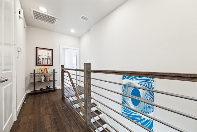 hall with baseboards, visible vents, wood finished floors, and recessed lighting