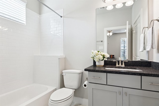 bathroom featuring shower / tub combination, toilet, visible vents, vanity, and baseboards