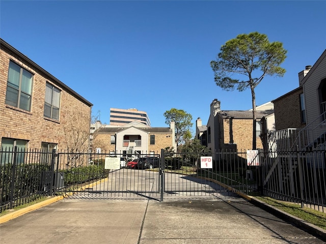 view of gate featuring fence