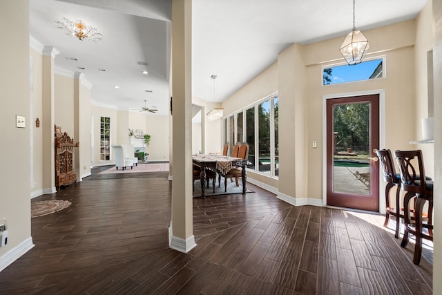 entrance foyer with visible vents, baseboards, ornamental molding, wood tiled floor, and recessed lighting