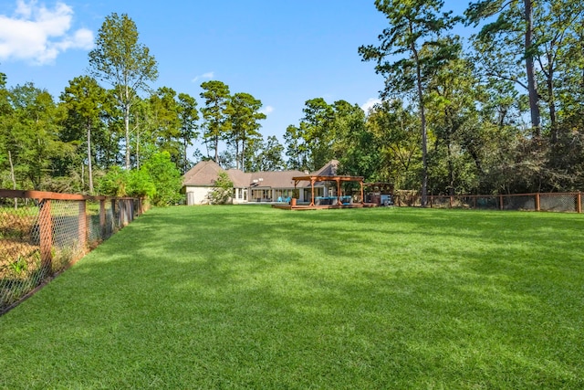 view of yard with a fenced backyard and a playground