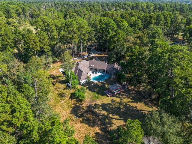 bird's eye view featuring a wooded view