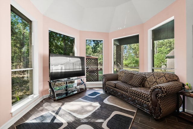 sunroom featuring lofted ceiling