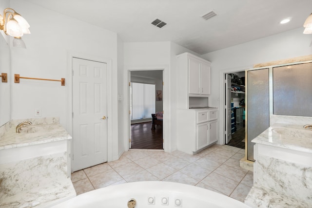 full bath featuring vanity, visible vents, and tile patterned floors
