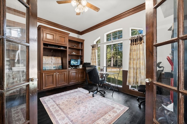 office area with dark wood-type flooring, a ceiling fan, and crown molding