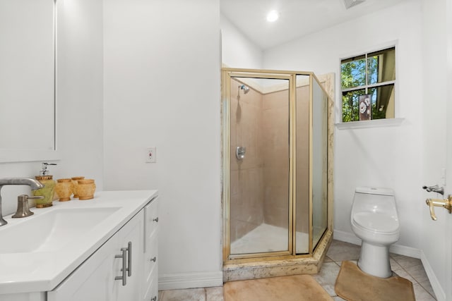 bathroom featuring baseboards, toilet, tile patterned floors, vanity, and a shower stall