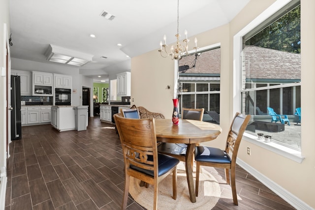dining area with recessed lighting, visible vents, wood tiled floor, a chandelier, and baseboards