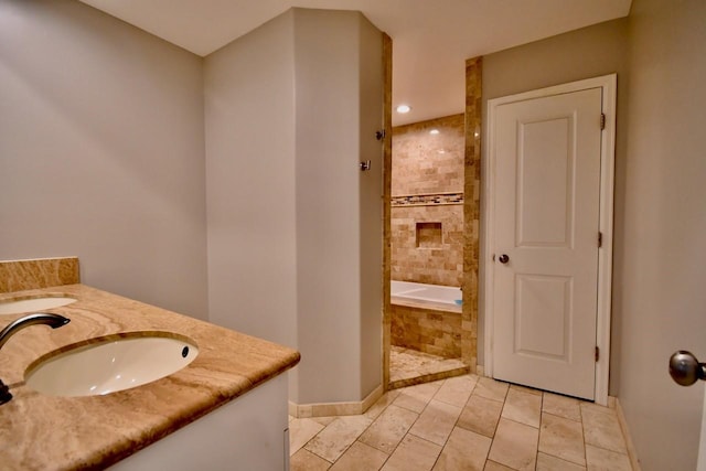 bathroom featuring tile patterned flooring, a sink, tiled shower, double vanity, and tiled tub