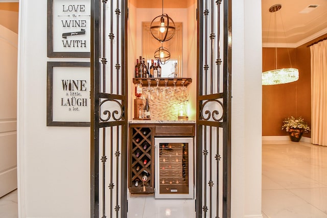 wine cellar featuring a bar and beverage cooler